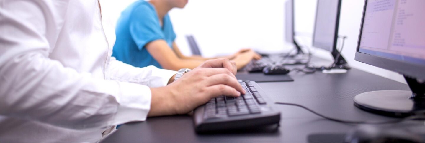 a person typing on a computer