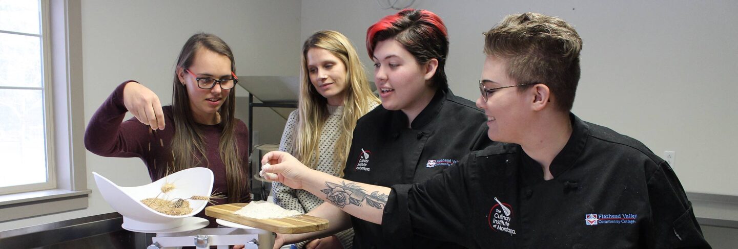 Ag and Culinary students processing wheat