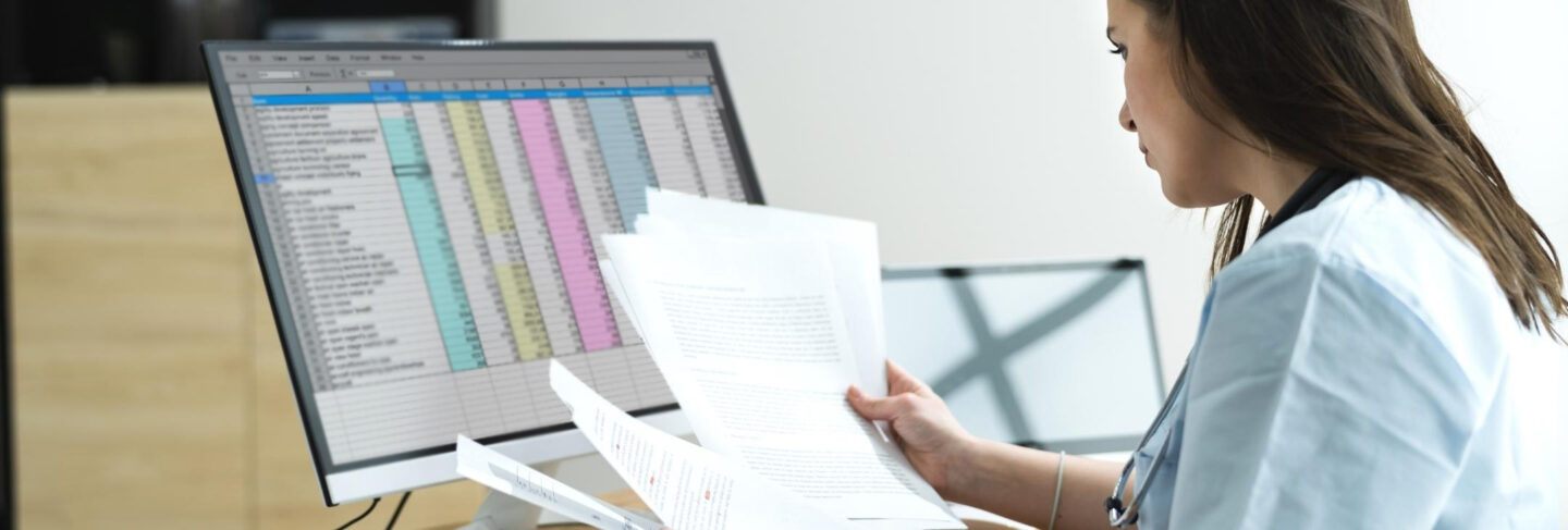 a nurse coding on a computer