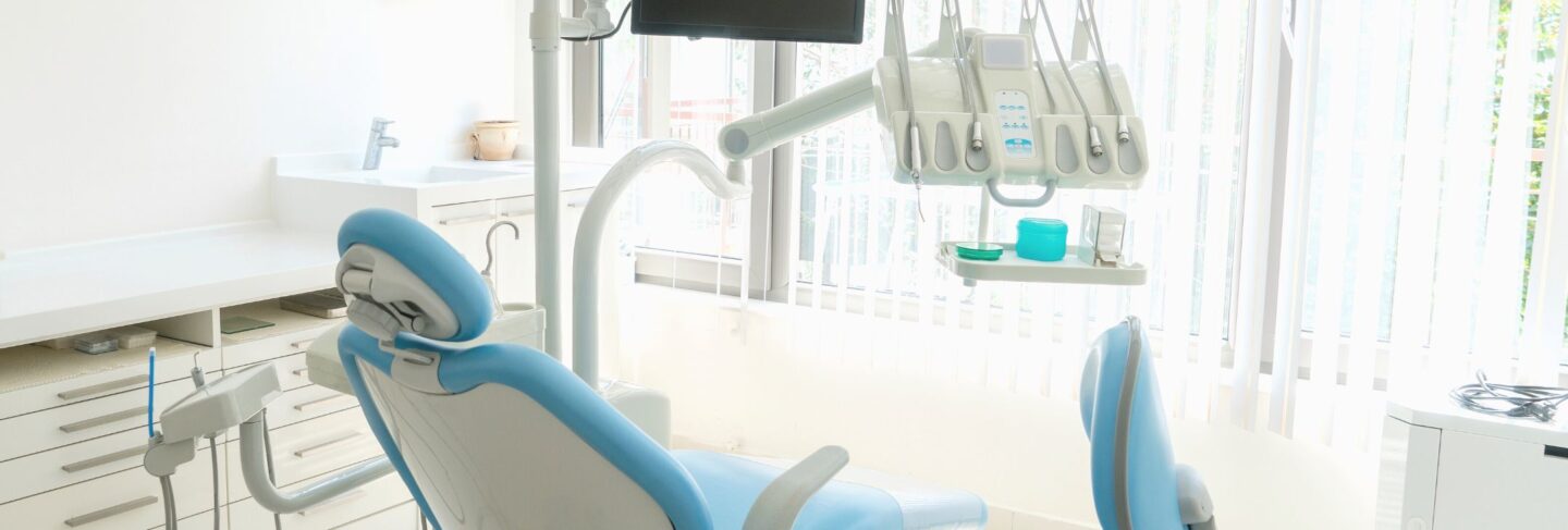 a dentist's office with tools and chair