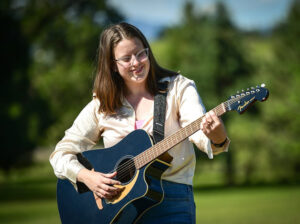 woman playing guitar