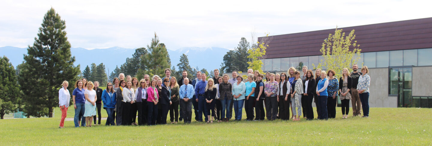 a group of staff standing outside