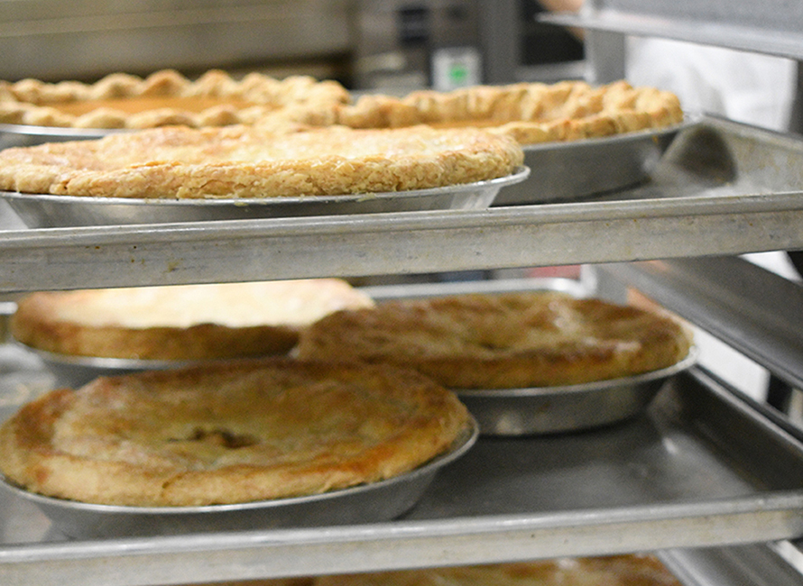 freshly baked pies resting on a rack