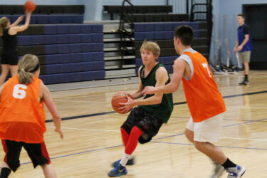 students playing basketball