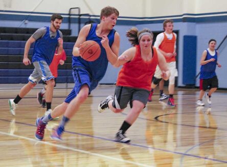 students playing basketball