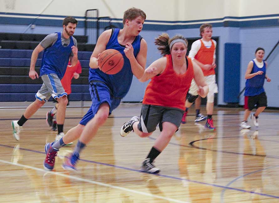 students playing basketball